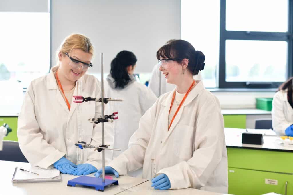 Two students carrying out an experiment